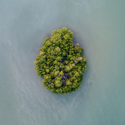 Island surrounded by water.