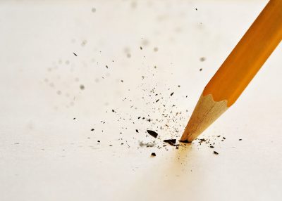 The lead of the pencil breaking after pressing down too hard.