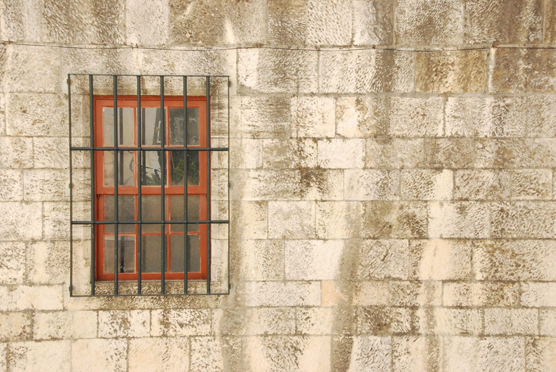 Window with bars of a medieval building